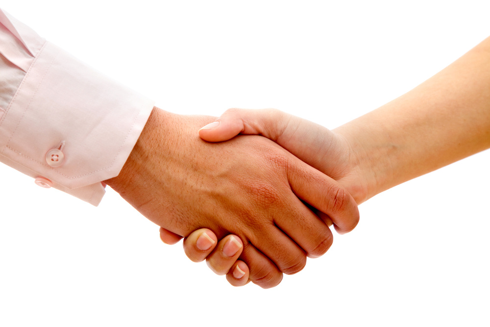 Business handshake isolated over a white background