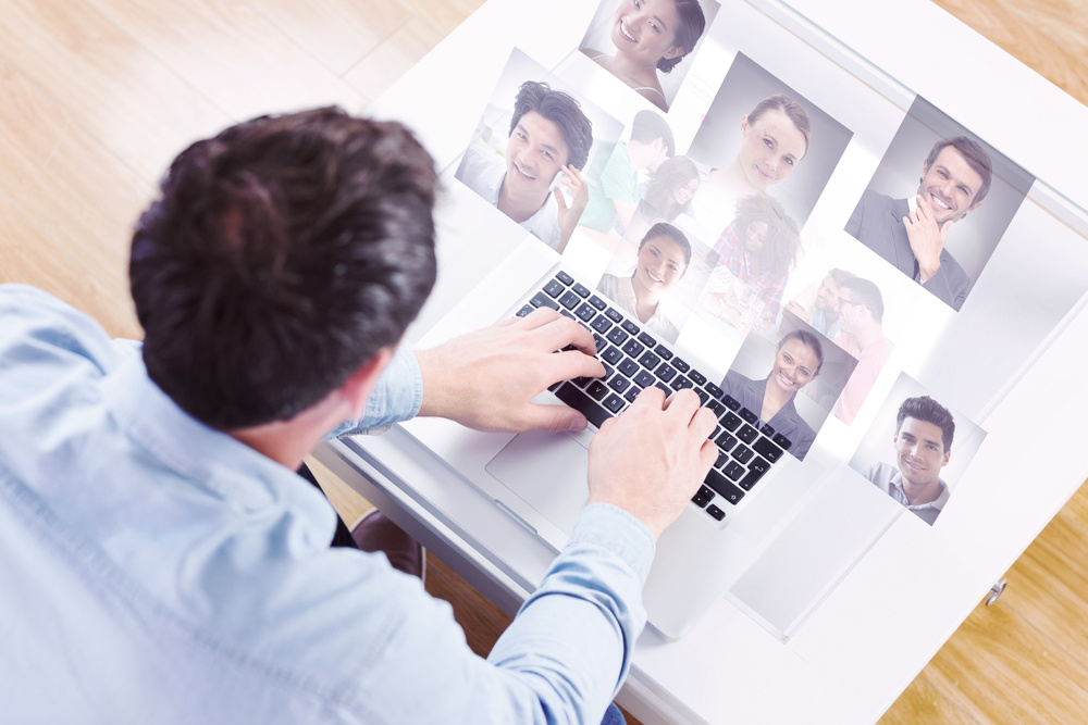 Creative team going over contact sheets in meeting against profile pictures